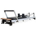 Align-Pilates C8-Pro Reformer with 8-wheel carriage system and Rapid Change spring bar, featuring a white aluminum frame for professional studio or home use, official authorized dealer The Kind Motion.