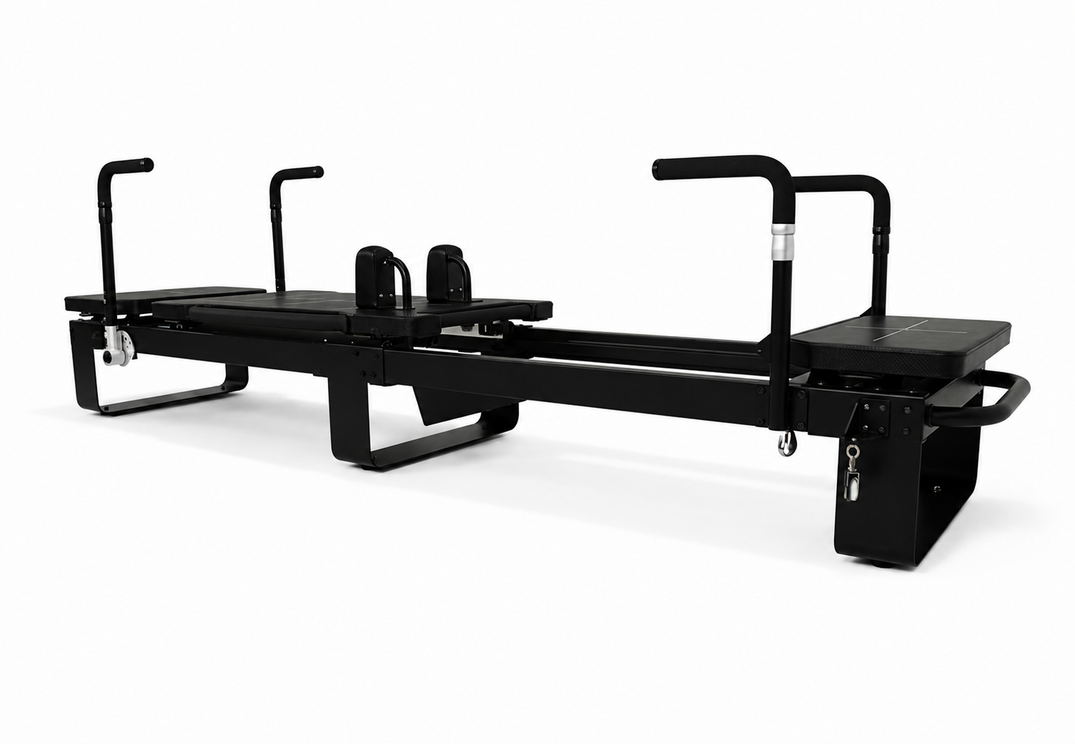Full length view of the Elina Corextreme Pilates reformer in black with padded platforms and adjustable handles
