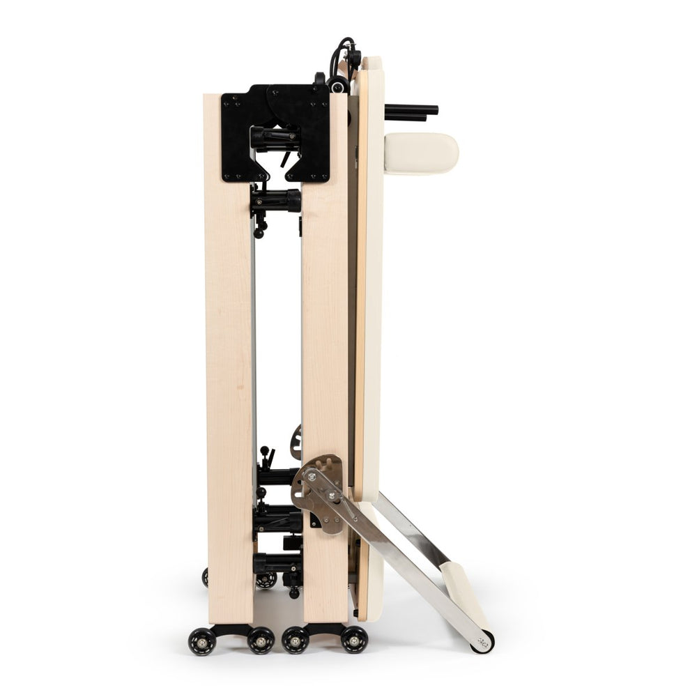 Elina Pilates foldable reformer from The Kind Motion, an authorized retailer. Features high-performance hardware and a durable folding frame.