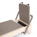 Close-up detail of the Elina Pilates infinite sliding foot bar for advanced positioning.