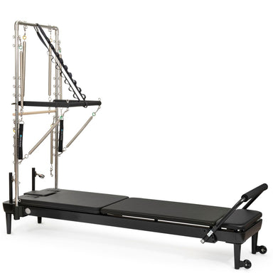 Elina Pilates Nubium Reformer with Tower in Black, featuring a sleek studio-grade aluminum frame and integrated Cadillac tower system for professional home Pilates, official authorized dealer The Kind Motion.