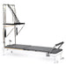 Elina Pilates Nubium Reformer with Tower Bundle in White, featuring a studio-grade aluminum frame and full Cadillac tower suite for professional home workouts, official authorized dealer The Kind Motion.