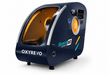 OxyRevo Space 60 navy blue hyperbaric chamber on a clean white studio background