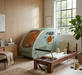 OxyRevo Space 60 sage green hyperbaric chamber in a wellness room with reformer