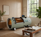 Quest 36 hyperbaric chamber in a room with plants and furniture